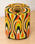 Psychedelic round printed ottoman featuring flowing retro patterns in vibrant orange, yellow and green