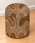 Blind Eye 004 round printed ottoman featuring warm brown and ochre abstract artwork